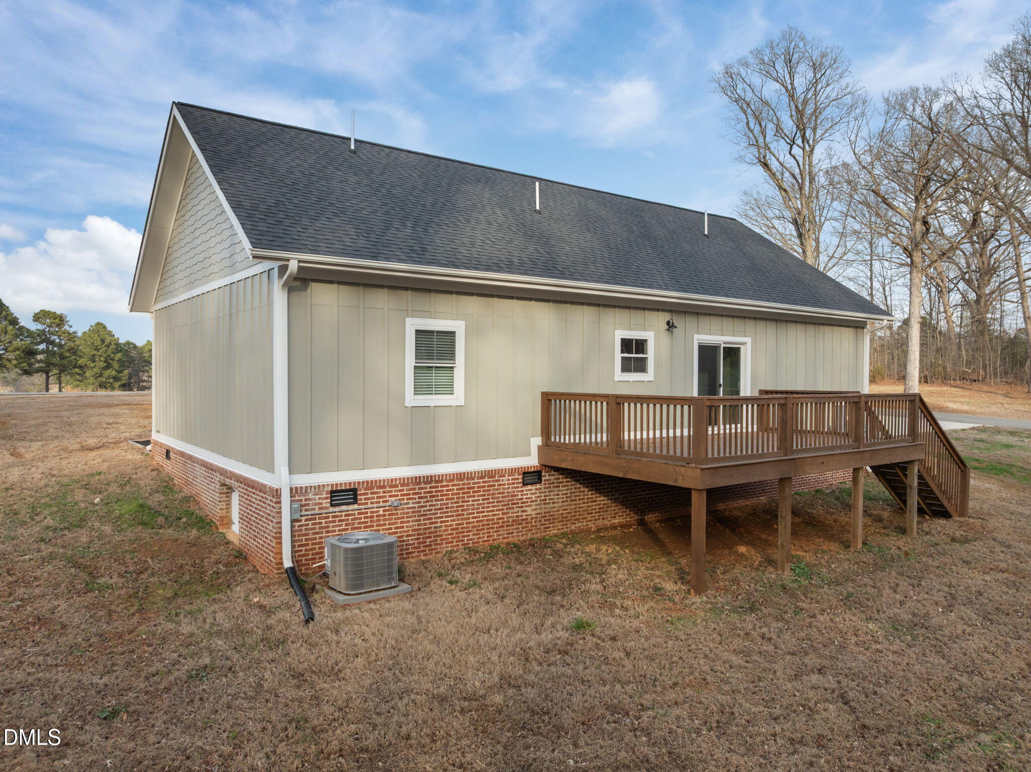 193 Community House Road, Unit A47 266 Roxboro, NC 27574 - Photo 14 of 55 a backyard of a house with wooden deck and outdoor seating