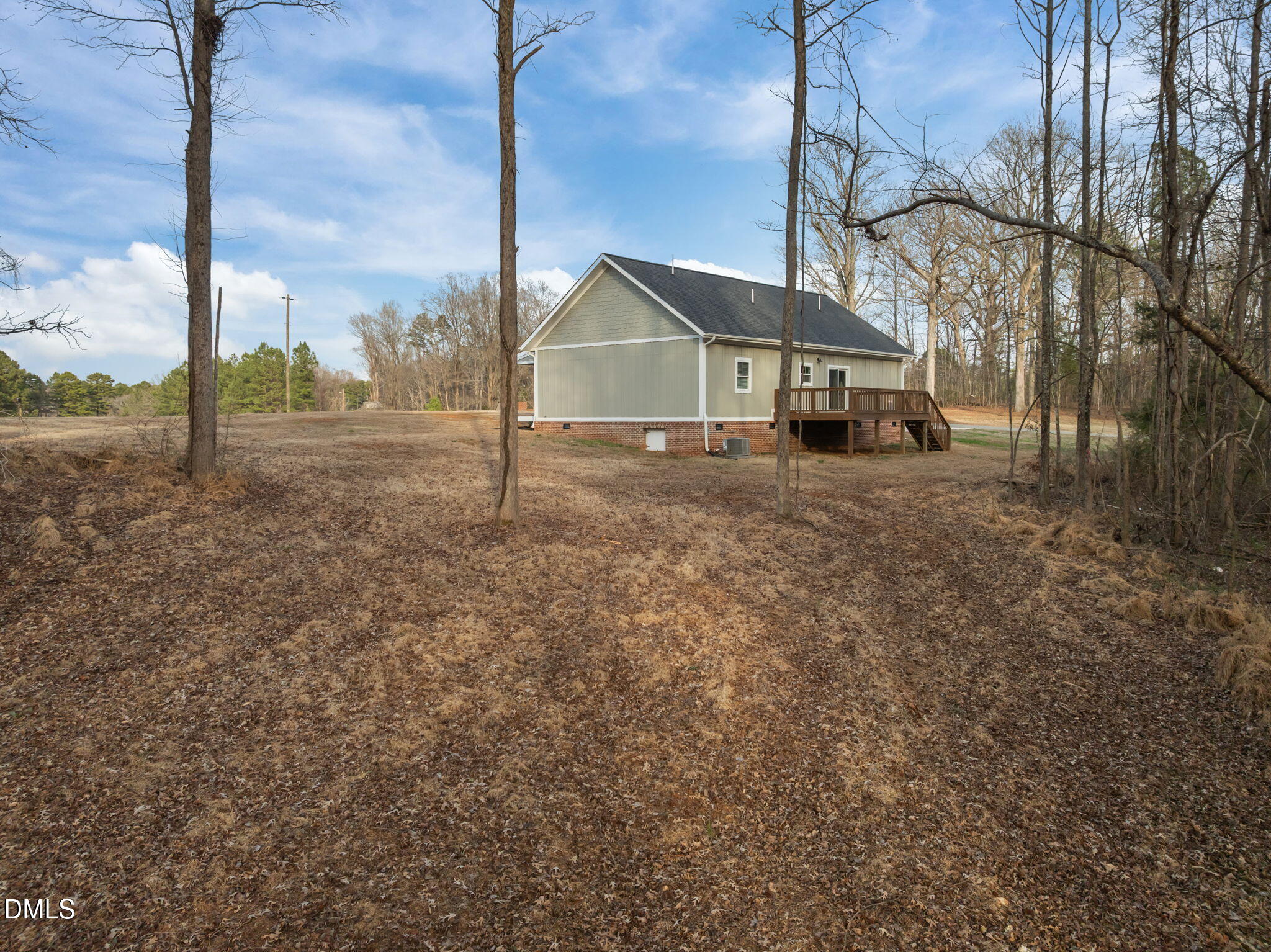 193 Community House Road, Unit A47 266 Roxboro, NC 27574 - Photo 17 of 55 a view of a house with a yard