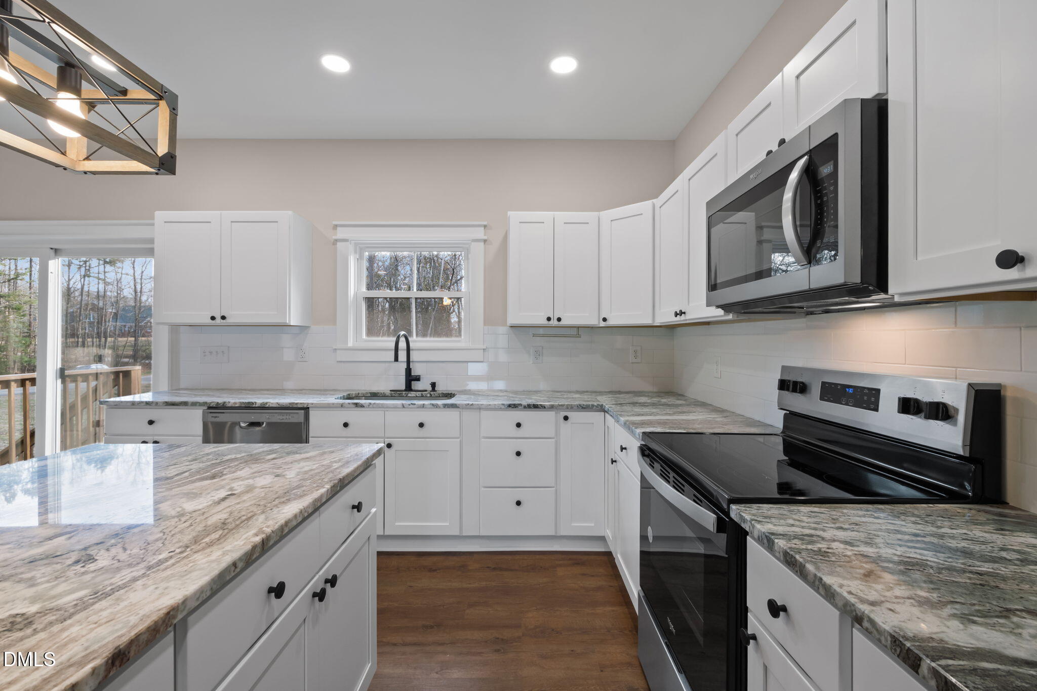 193 Community House Road, Unit A47 266 Roxboro, NC 27574 - Photo 34 of 55 a kitchen with stainless steel appliances granite countertop a sink stove and microwave