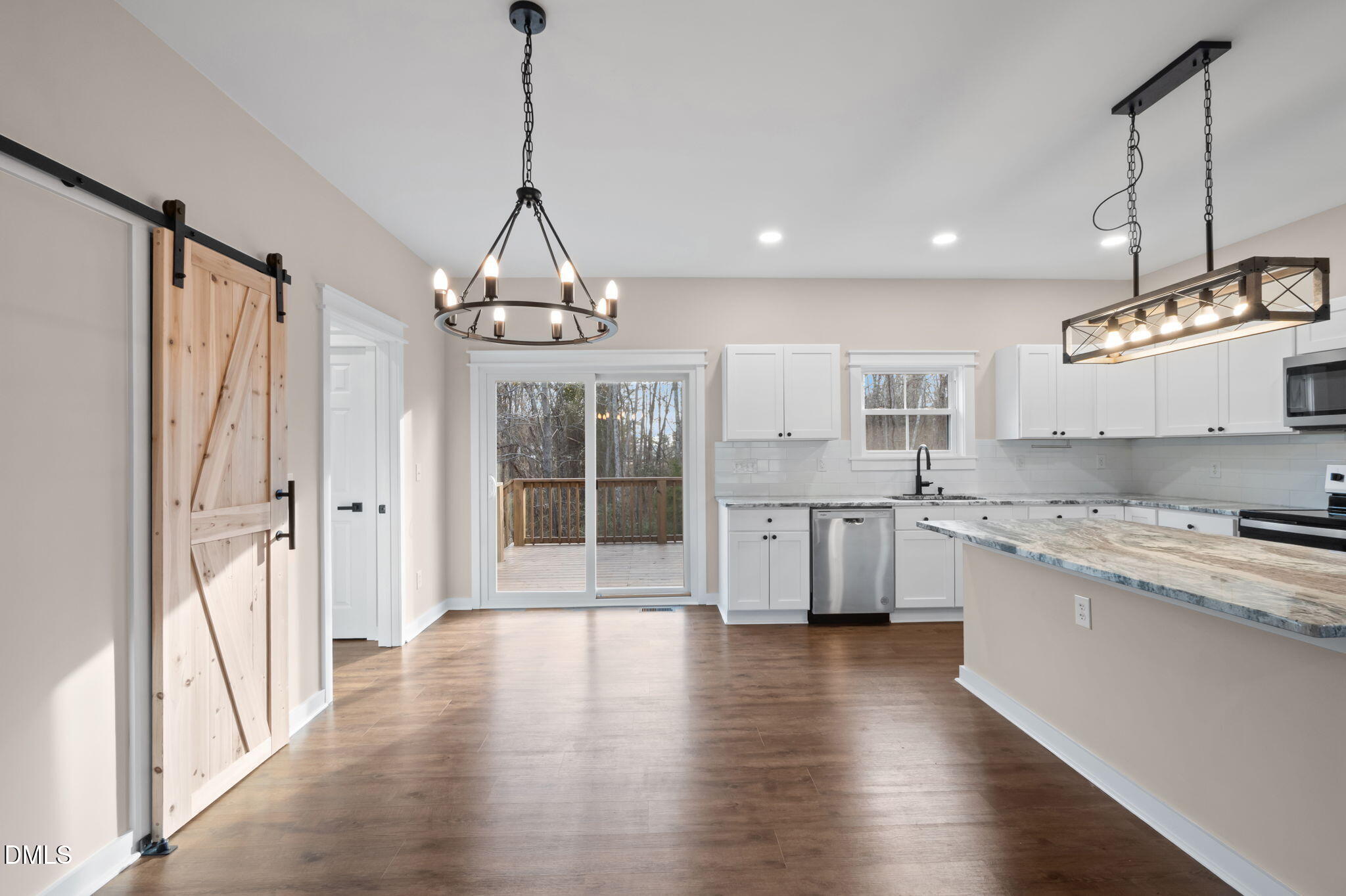 193 Community House Road, Unit A47 266 Roxboro, NC 27574 - Photo 38 of 55 a kitchen with stainless steel appliances granite countertop a stove a sink dishwasher a refrigerator and white cabinets with wooden floor