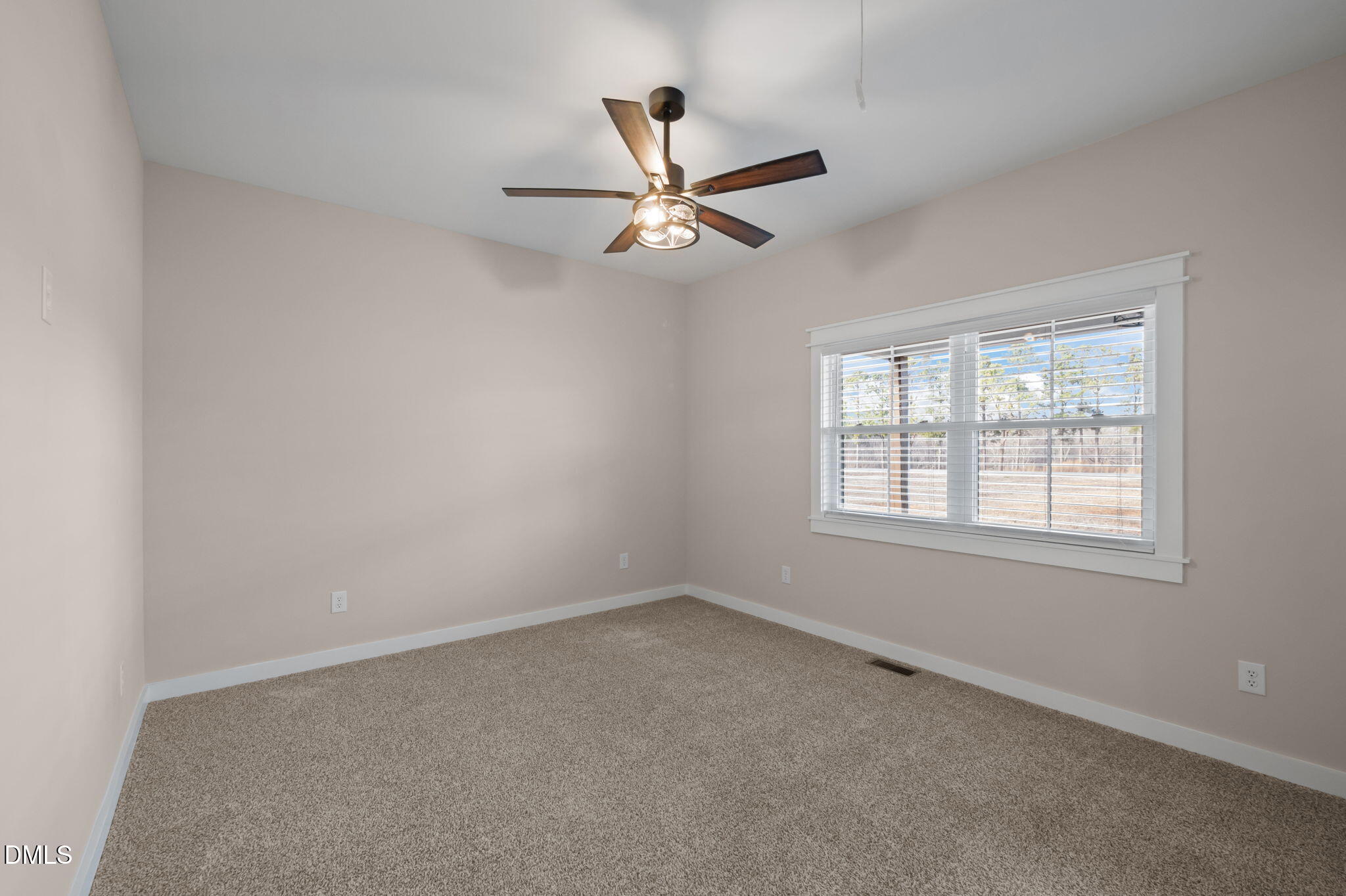 193 Community House Road, Unit A47 266 Roxboro, NC 27574 - Photo 39 of 55 an empty room with a window and a fan