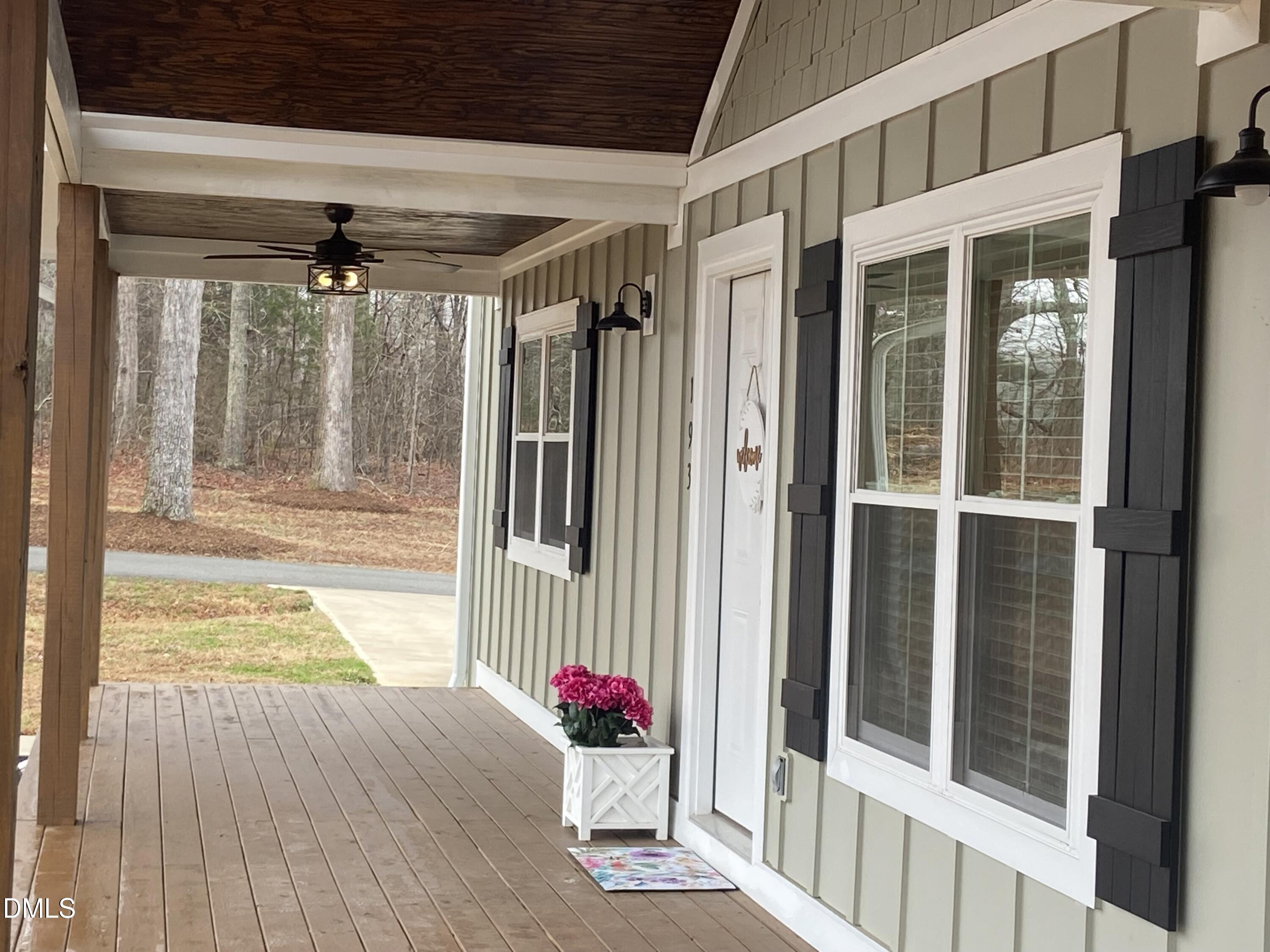 193 Community House Road, Unit A47 266 Roxboro, NC 27574 - Photo 4 of 55 a view of a porch with a table and chairs