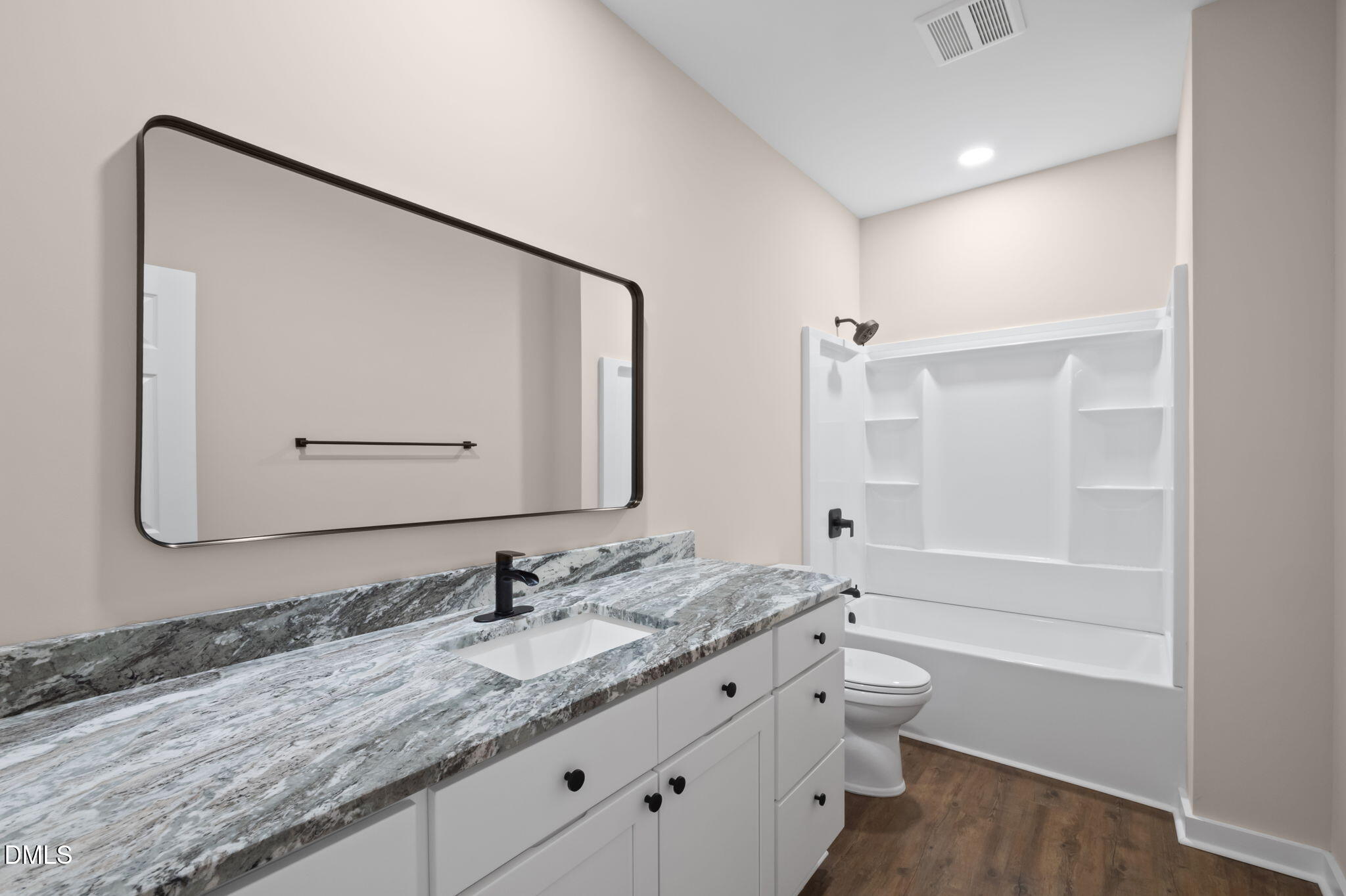 193 Community House Road, Unit A47 266 Roxboro, NC 27574 - Photo 41 of 55 a bathroom with a granite countertop sink a mirror and a bathtub