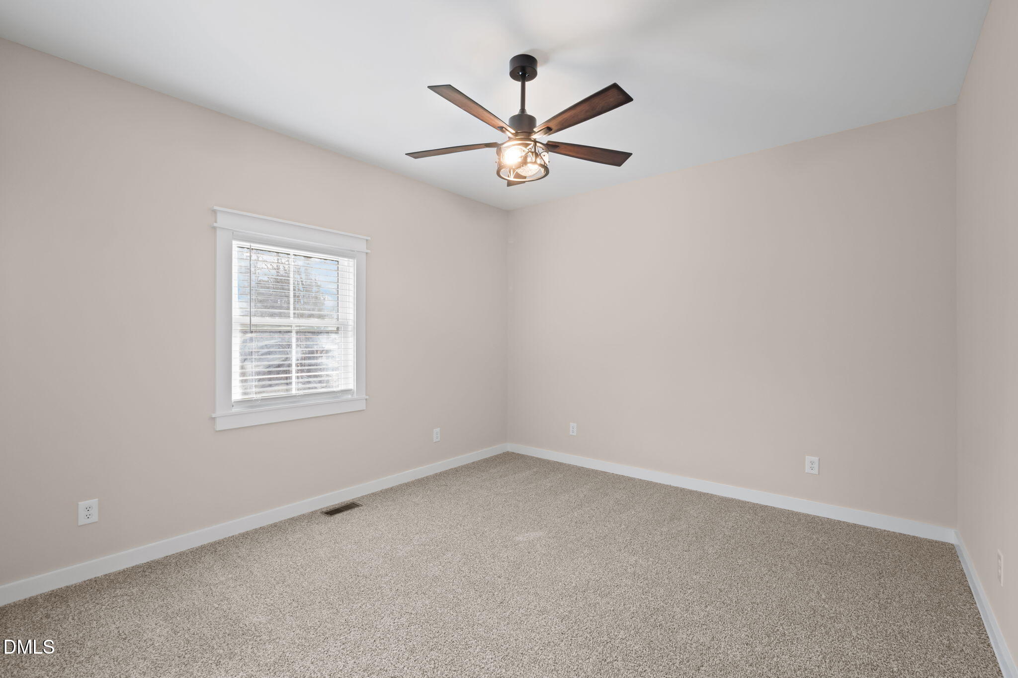193 Community House Road, Unit A47 266 Roxboro, NC 27574 - Photo 42 of 55 an empty room with a window and a fan