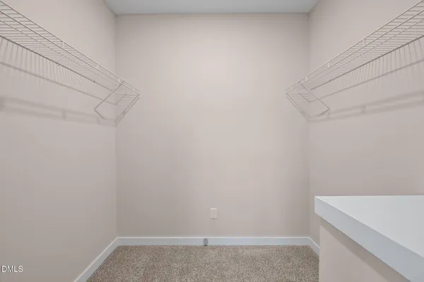 a view of storage and utility room with wooden floor