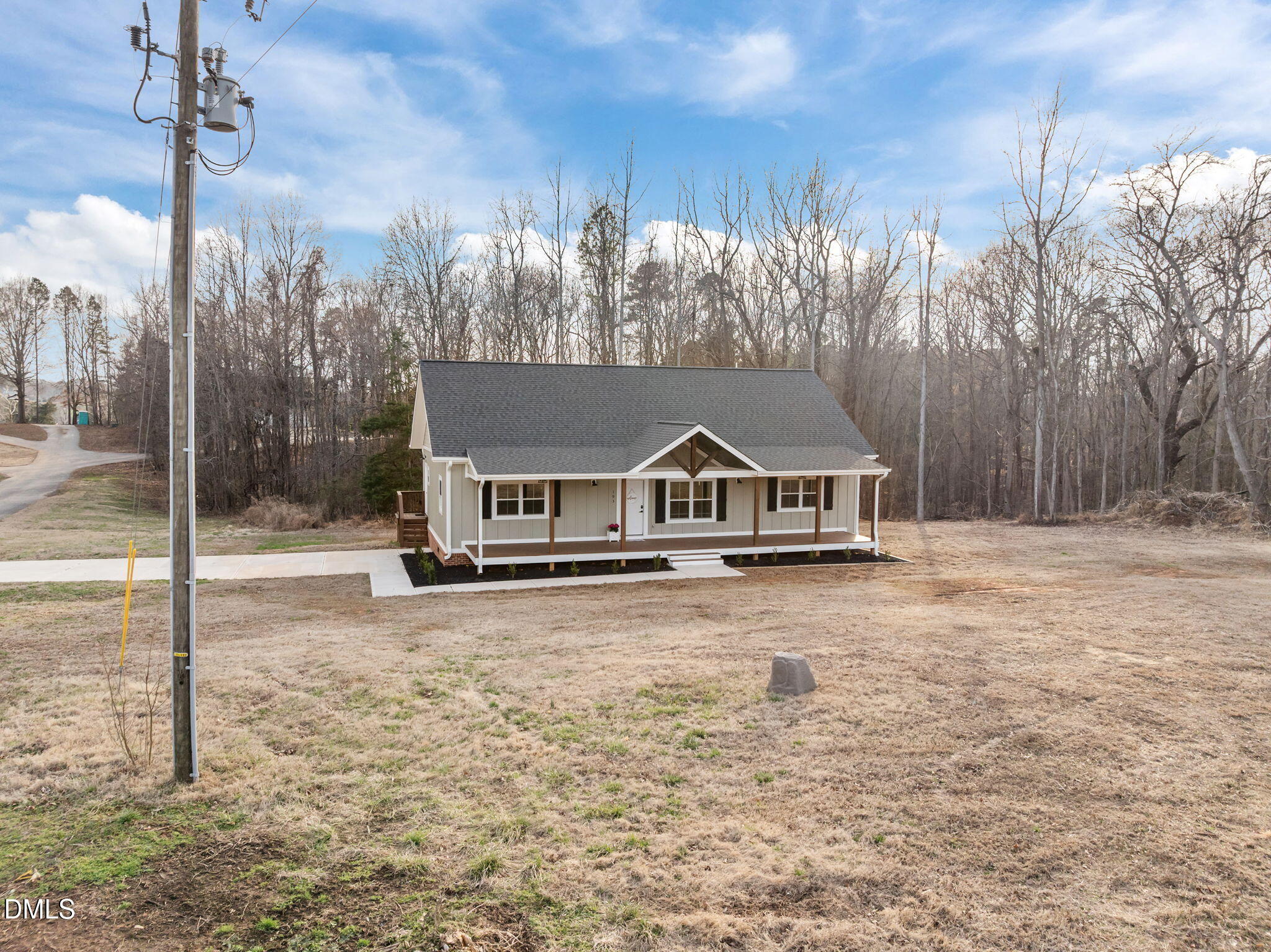 193 Community House Road, Unit A47 266 Roxboro, NC 27574 - Photo 9 of 55 a house with trees in the background