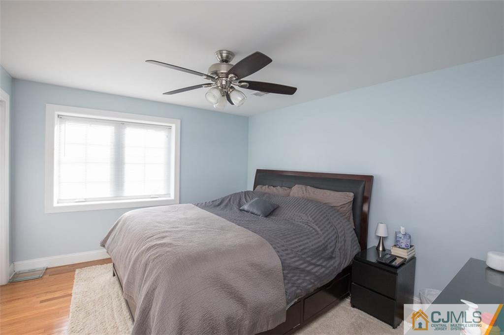 28 Fox Road Edison, NJ 08817 - Photo 14 of 25 a bedroom with a bed and a window
