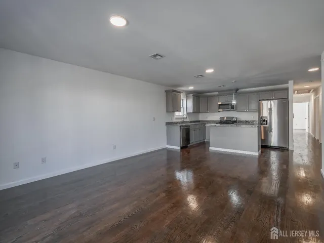 a view of kitchen with wooden floor