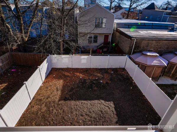 a view of a chairs and table in the patio