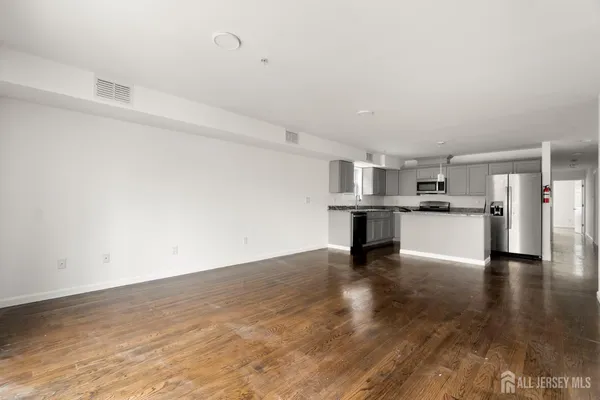 a view of kitchen with wooden floor