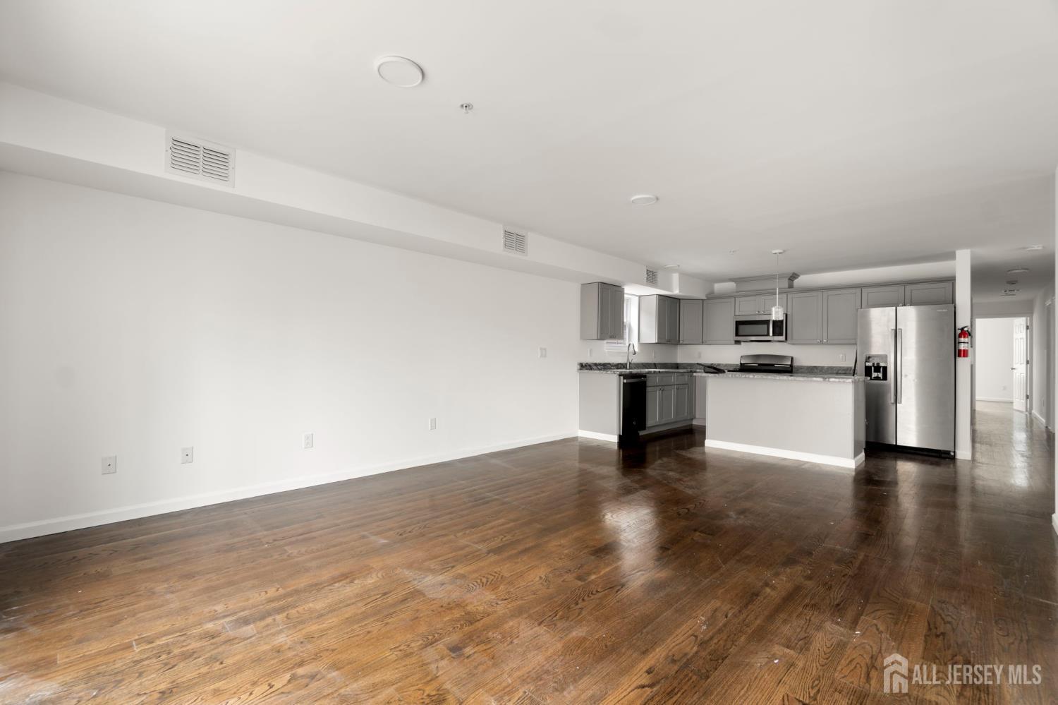 496 South 18th Street, Unit 2 Newark, NJ 07103 - Photo 4 of 21 a view of kitchen with wooden floor