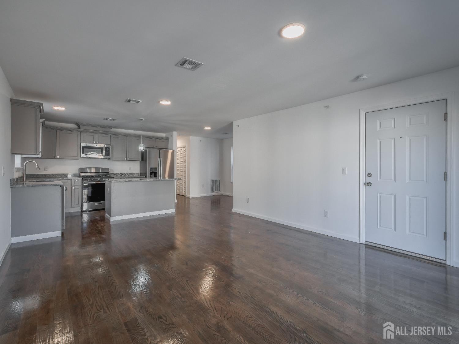 496 South 18th Street, Unit 2 Newark, NJ 07103 - Photo 4 of 15 a view of kitchen with wooden floor
