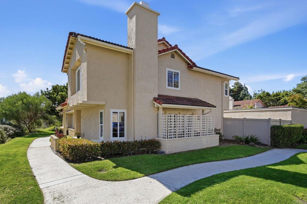 1733 Gentle Breeze Lane Encinitas, CA 92024 - Photo 1 of 1 a front view of a house with a garden and plants