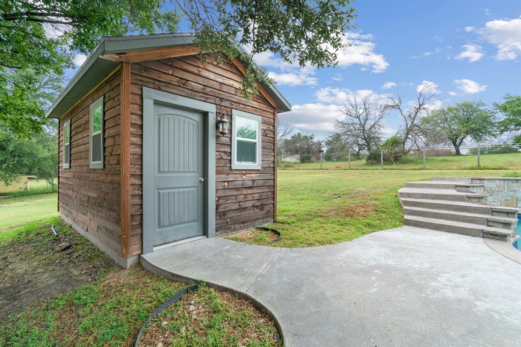 217 Naibara Trail Weatherford, TX 76088 - Photo 24 of 35 a view of a house with a backyard and a garden