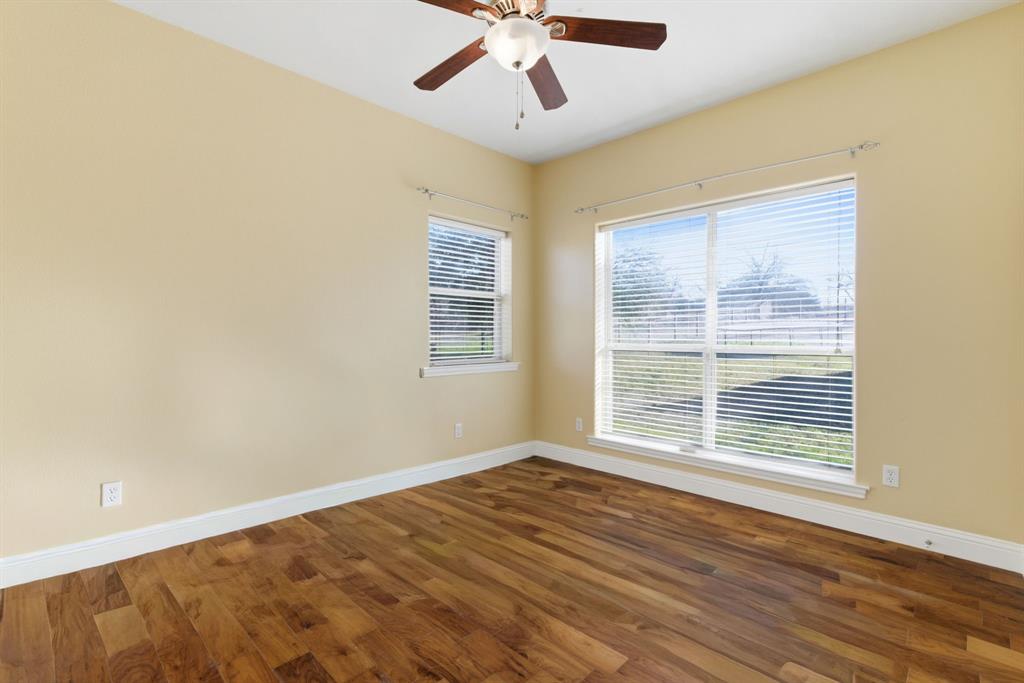 217 Naibara Trail Weatherford, TX 76088 - Photo 25 of 40 a view of an empty room with wooden floor and a window