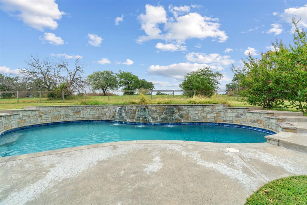 217 Naibara Trail Weatherford, TX 76088 - Photo 30 of 40 a view of a swimming pool and an outdoor space