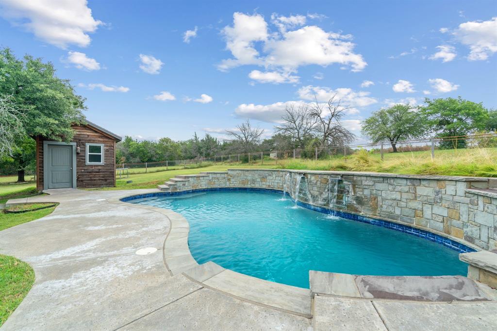 217 Naibara Trail Weatherford, TX 76088 - Photo 3 of 40 a view of an swimming pool and an outdoor space