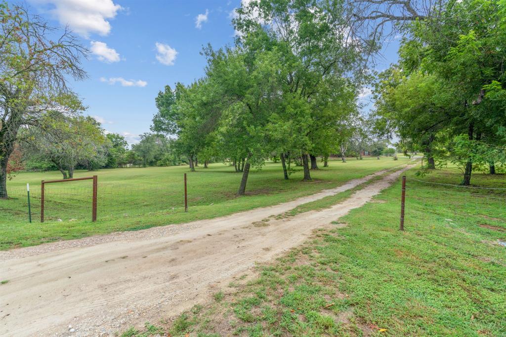 217 Naibara Trail Weatherford, TX 76088 - Photo 34 of 40 a view of road with large trees