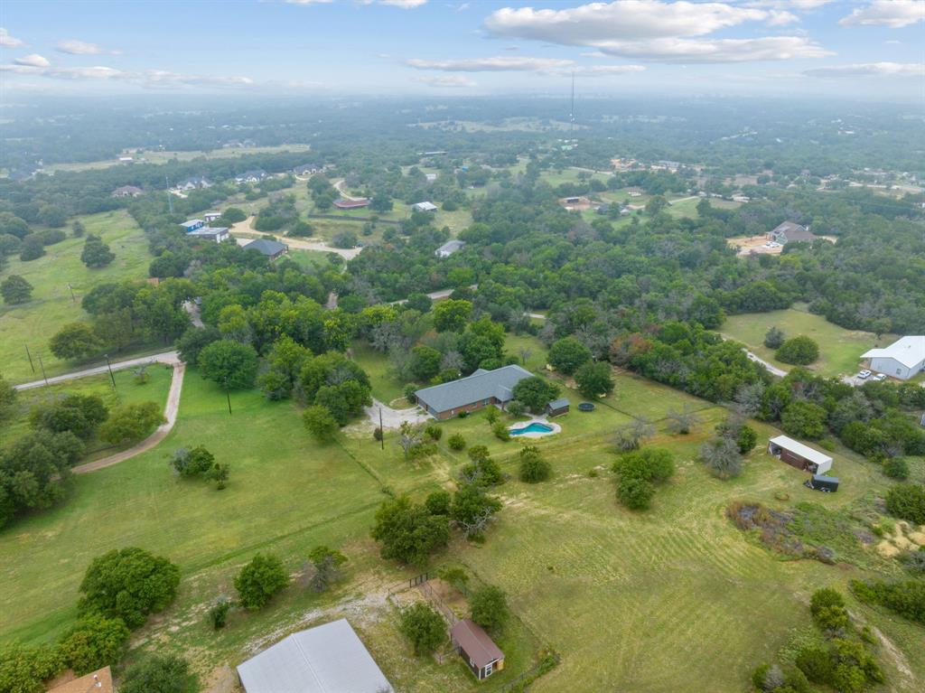 217 Naibara Trail Weatherford, TX 76088 - Photo 34 of 35 an aerial view of residential houses with outdoor space and trees