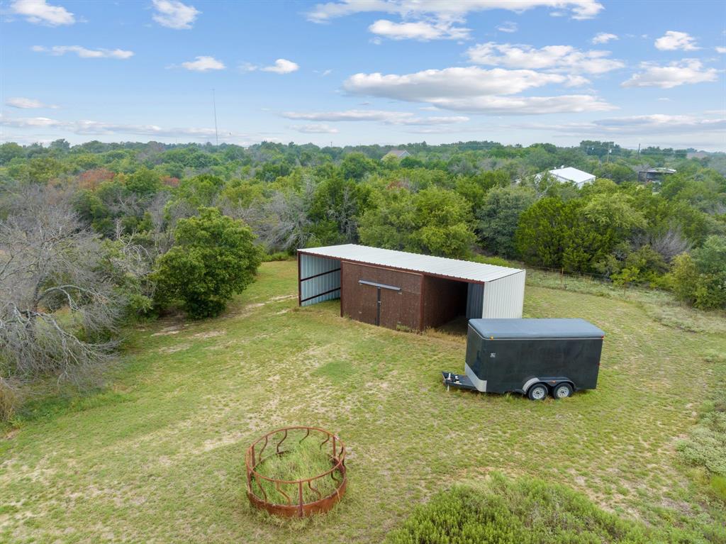 217 Naibara Trail Weatherford, TX 76088 - Photo 40 of 40 a backyard of a house with table and chairs