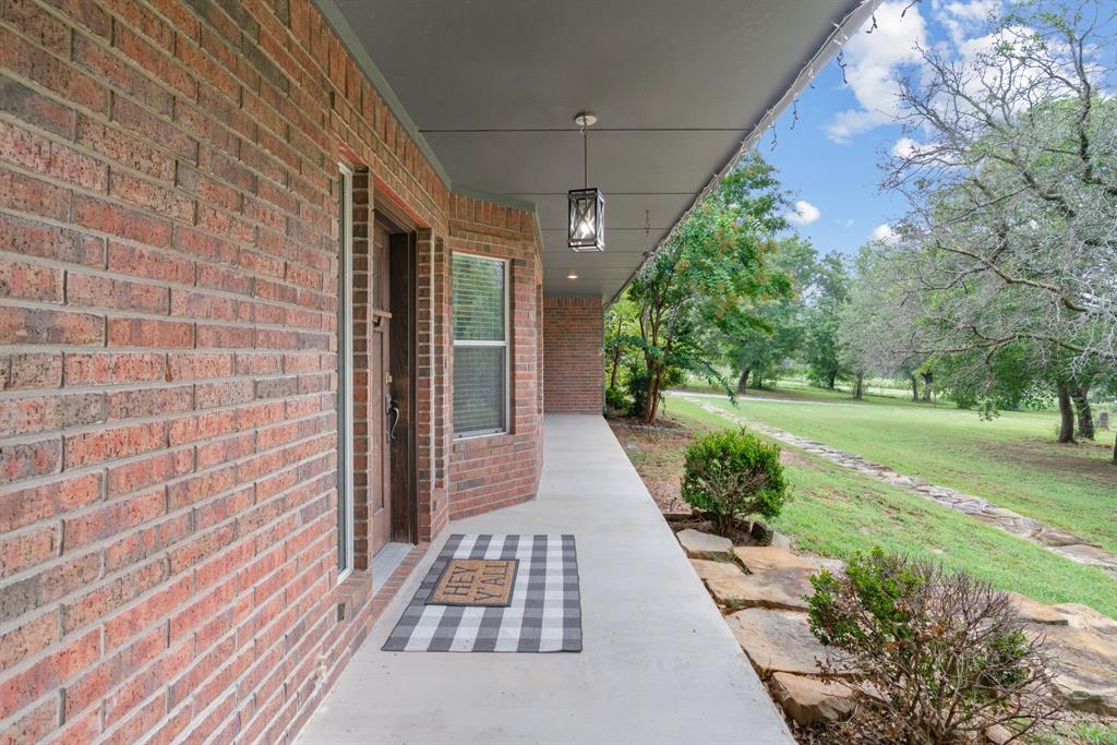 217 Naibara Trail Weatherford, TX 76088 - Photo 4 of 35 a view of a pathway with a garden