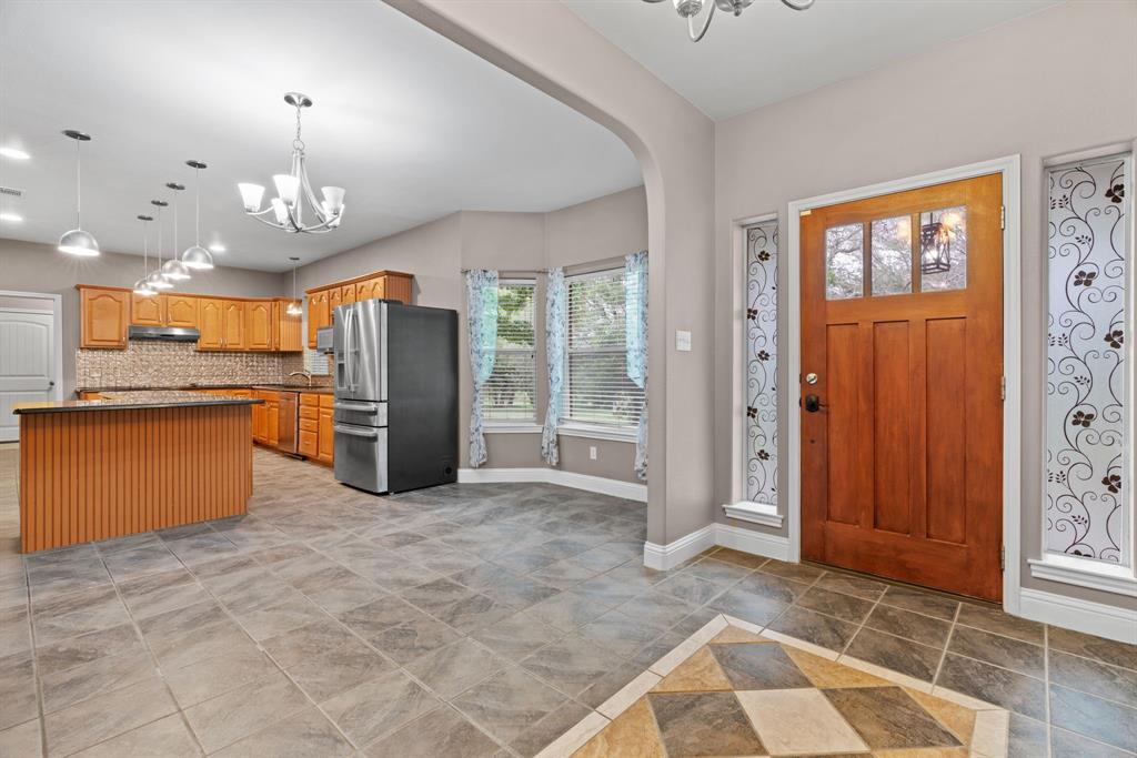 217 Naibara Trail Weatherford, TX 76088 - Photo 5 of 35 a view of a kitchen with a sink and cabinets