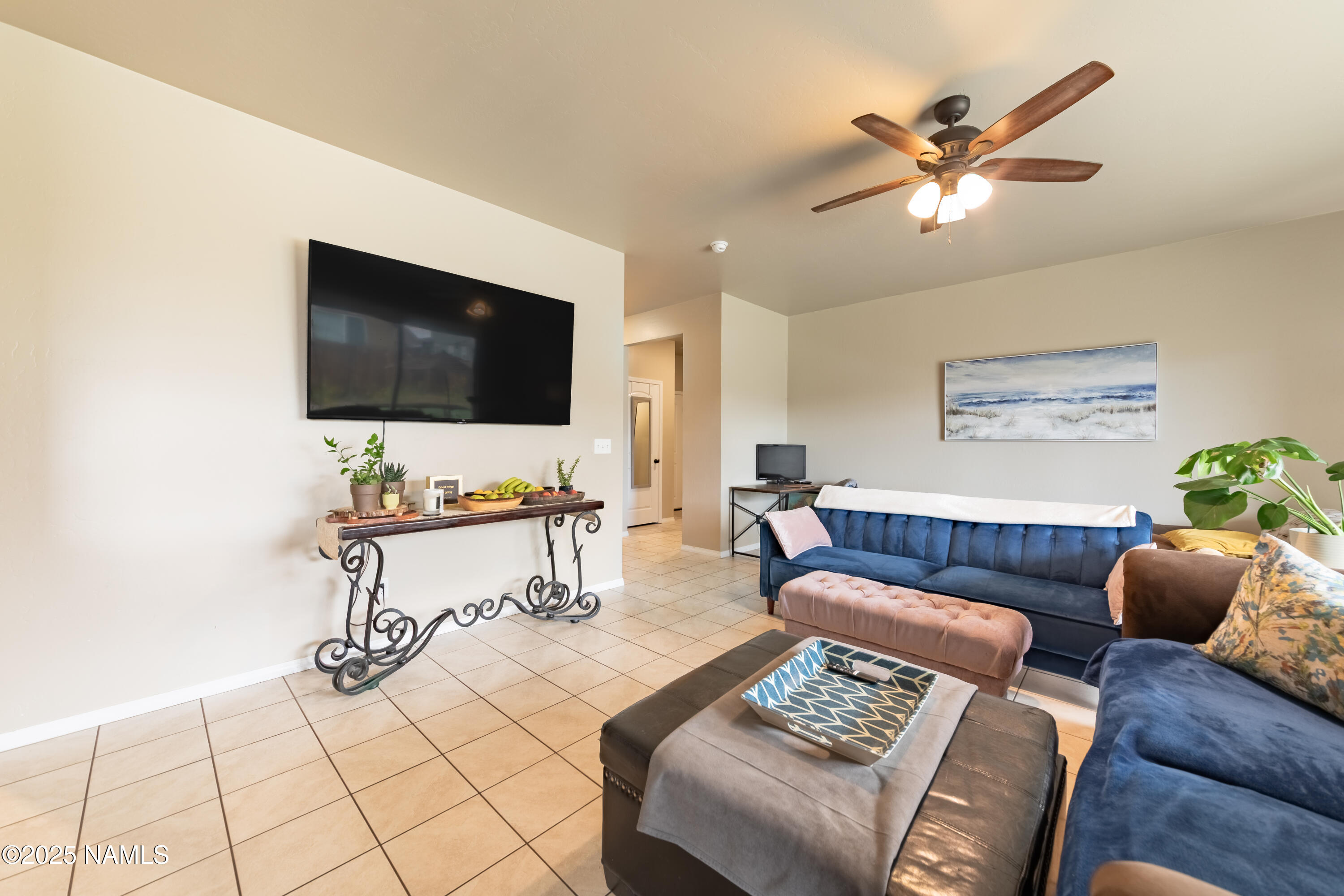 4500 Centaurus Road Bellemont, AZ 86015 - Photo 4 of 20 a living room with furniture and a flat screen tv