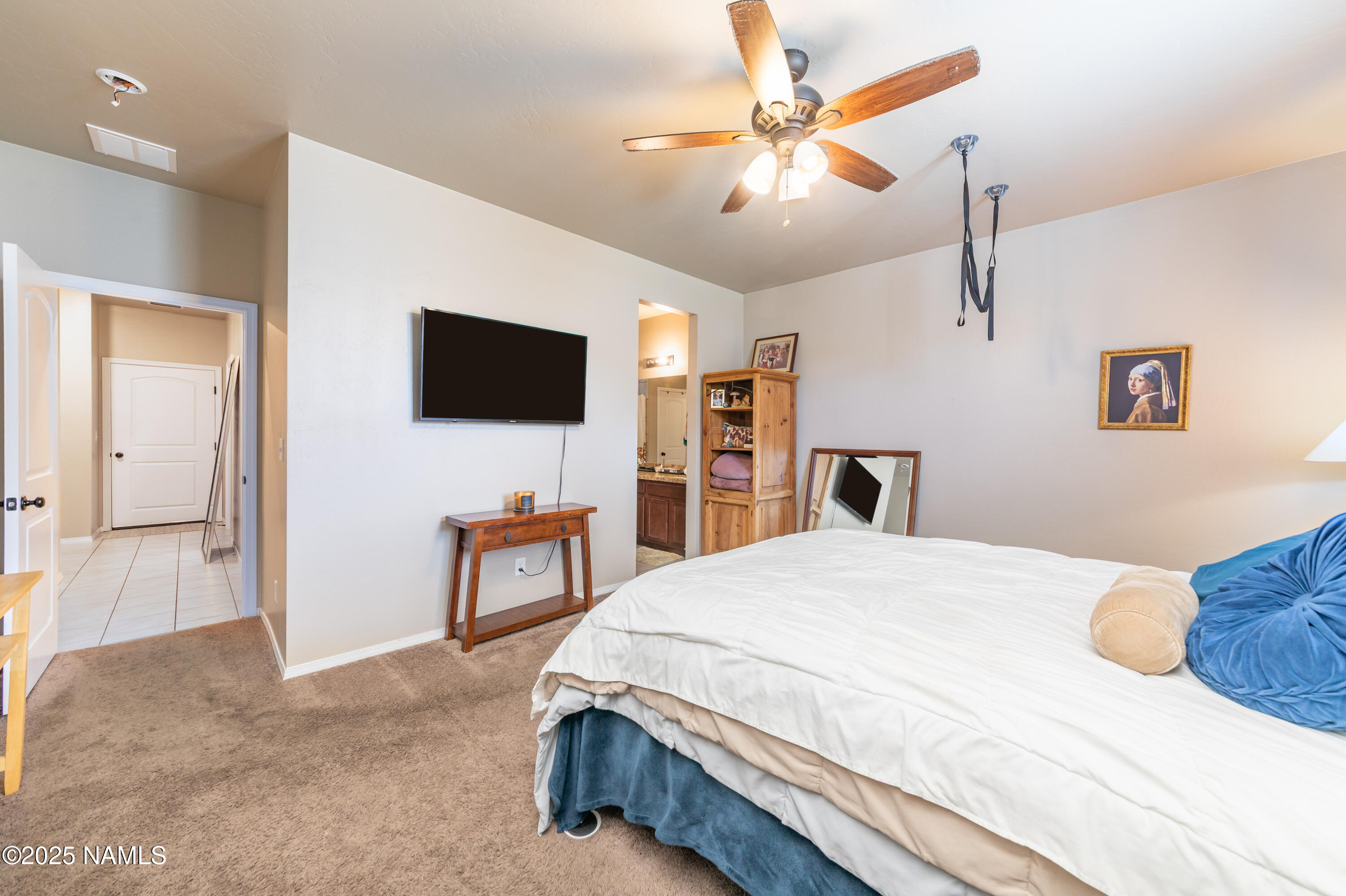 4500 Centaurus Road Bellemont, AZ 86015 - Photo 10 of 20 a bedroom with a bed and a flat screen tv