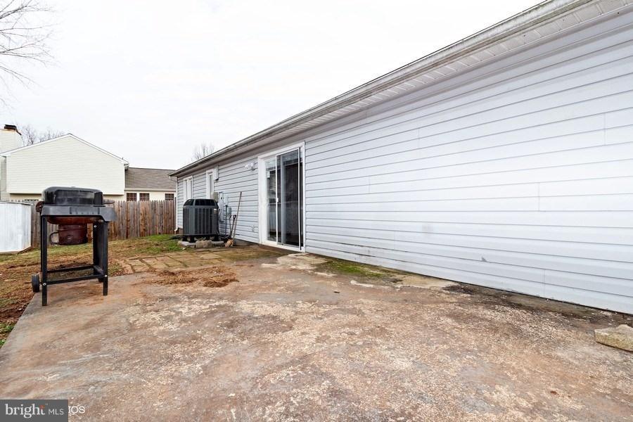 8313 Shady Spring Drive Gaithersburg, MD 20877 - Photo 2 of 10 Rear view of home and yard