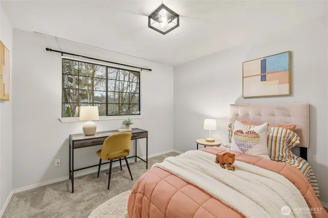 a bedroom with a bed and a table