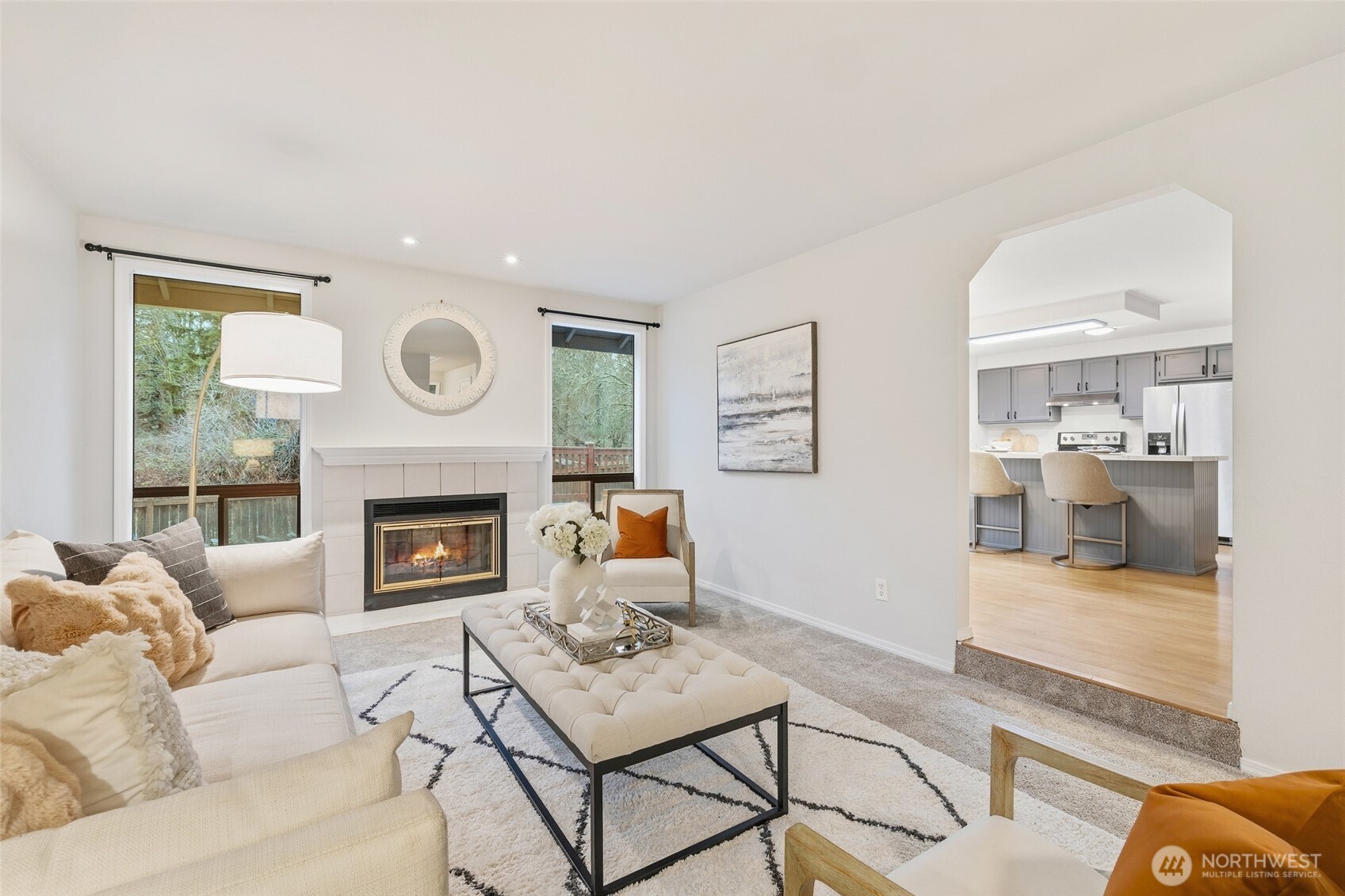 23506 13th Place West Bothell, WA 98021 - Photo 5 of 26 a living room with furniture a clock and a fireplace