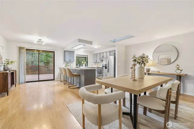a view of a dining room with furniture and a livingroom