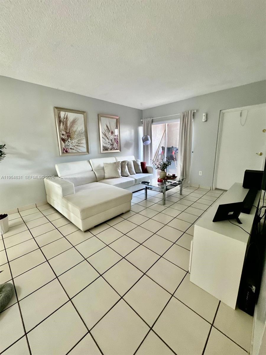 15645 Southwest 82nd Cir Lane, Unit 75 Miami, FL 33193 - Photo 20 of 20 a living room with furniture and a window