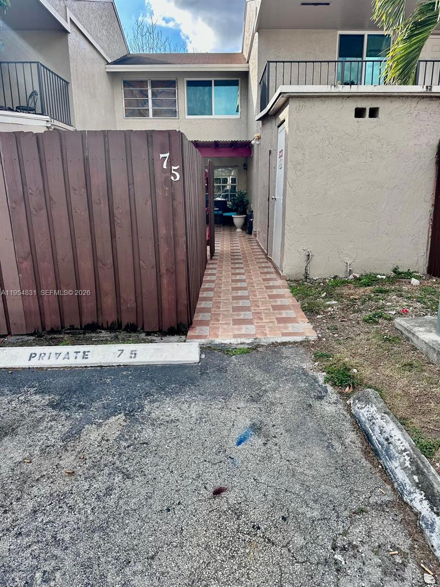 15645 Southwest 82nd Cir Lane, Unit 75 Miami, FL 33193 - Photo 2 of 20 a view of a wooden fence