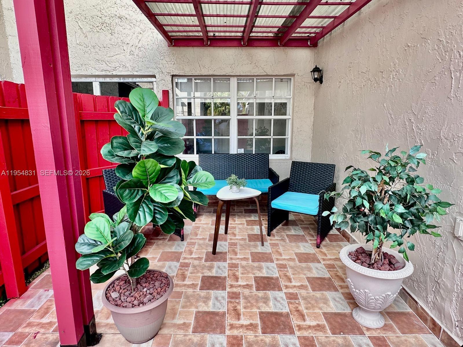15645 Southwest 82nd Cir Lane, Unit 75 Miami, FL 33193 - Photo 4 of 20 a outdoor dining space with furniture