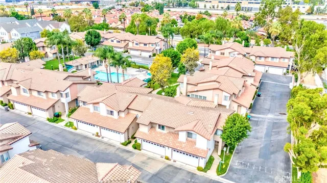 a sign that is on a pole with a swimming pool