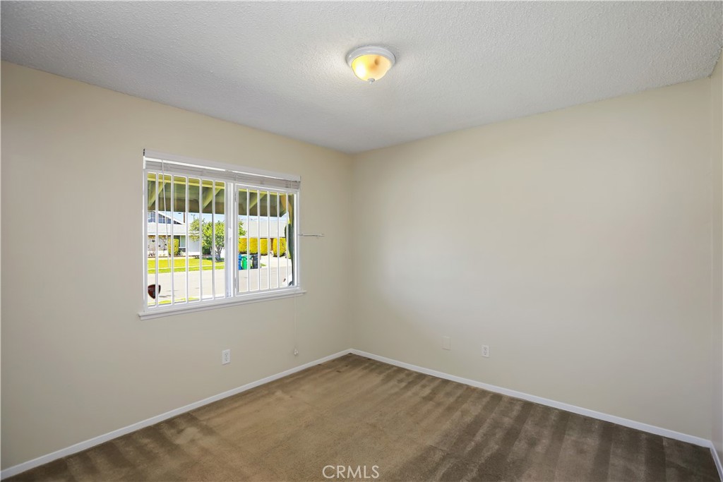 15902 King Circle Westminster, CA 92683 - Photo 22 of 43 an empty room with windows