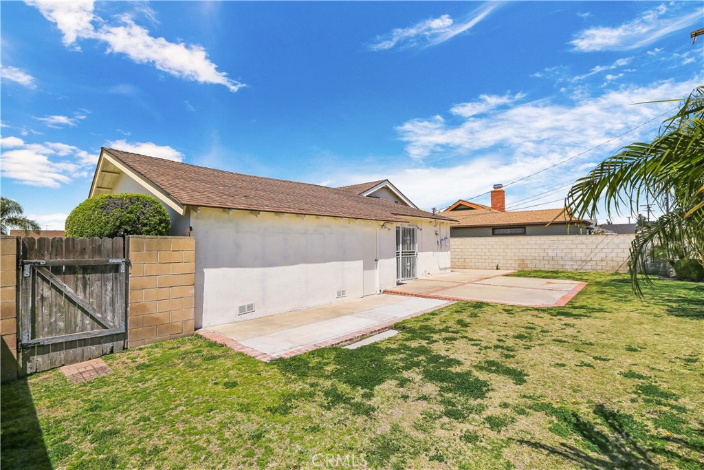15902 King Circle Westminster, CA 92683 - Photo 38 of 43 a view of a house with backyard and a tree