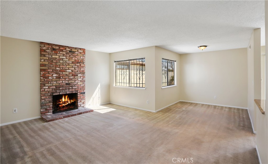 15902 King Circle Westminster, CA 92683 - Photo 4 of 43 a view of an empty room with a window and fireplace