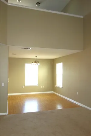a view of an empty room and a window