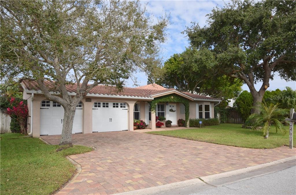 17307 Rosa Lee Way North Redington Beach, FL 33708 - Photo 1 of 1 Large pie shaped lot with pavered drivewa, tile roof, and mature landscaping.