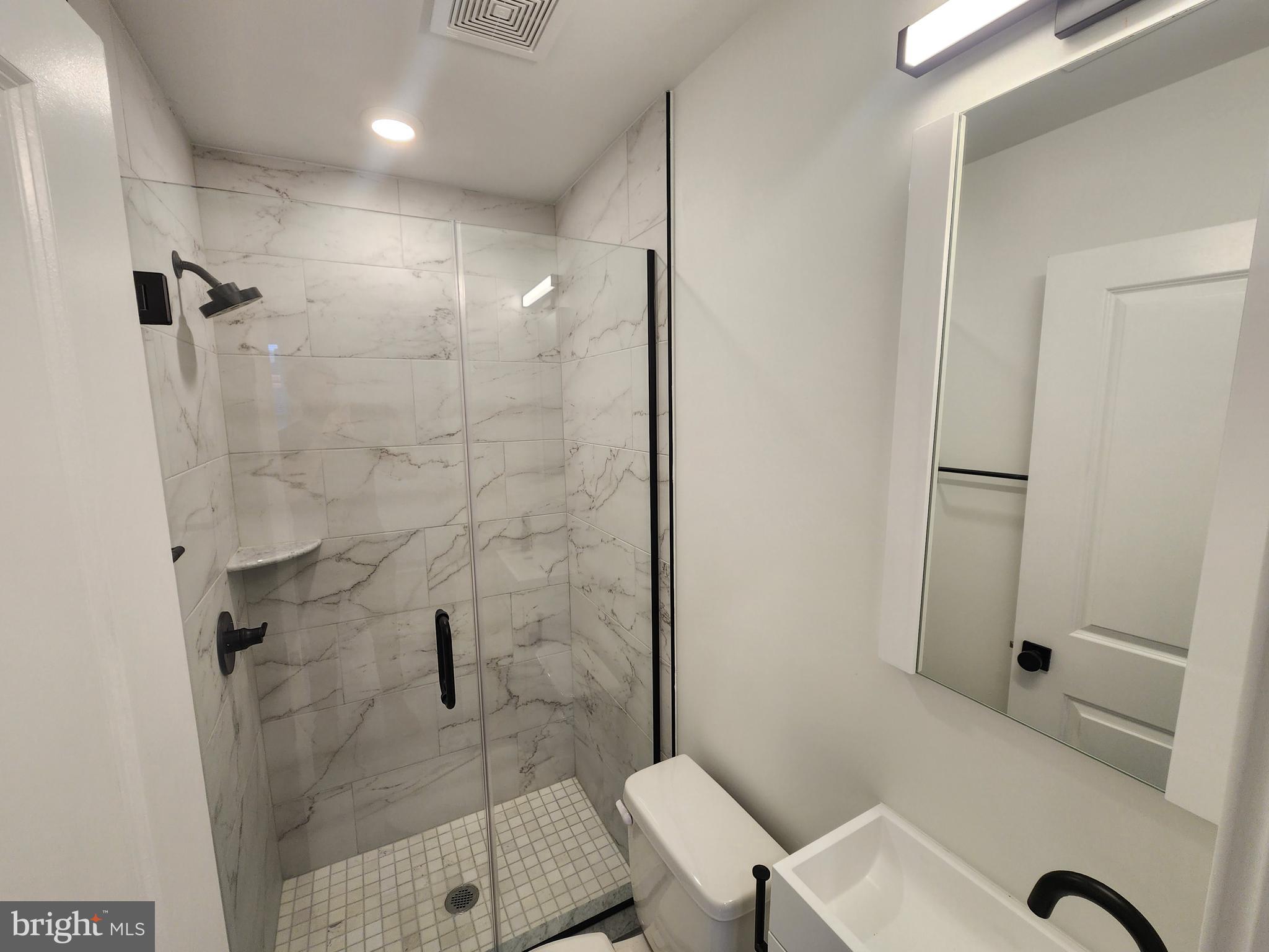 1838 North 17th Street, Unit 3 Philadelphia, PA 19121 - Photo 12 of 14 a bathroom with a sink and a toilet