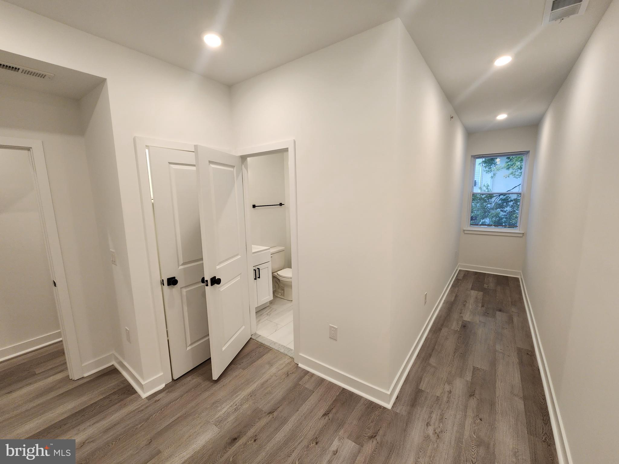 1838 North 17th Street, Unit 3 Philadelphia, PA 19121 - Photo 13 of 14 a view of a hallway with wooden floor