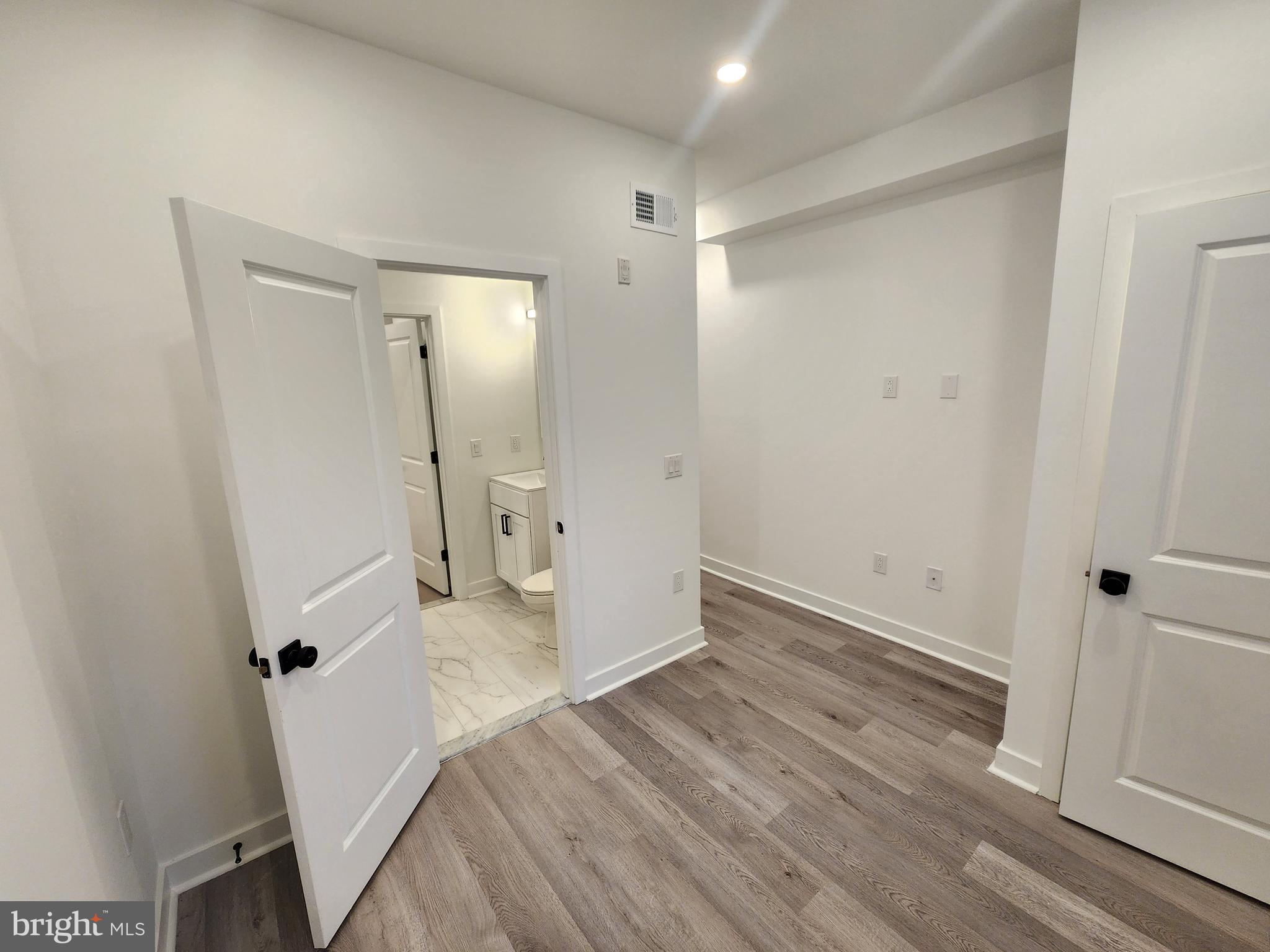 1838 North 17th Street, Unit 3 Philadelphia, PA 19121 - Photo 14 of 14 a view of a big room with wooden floor and closet