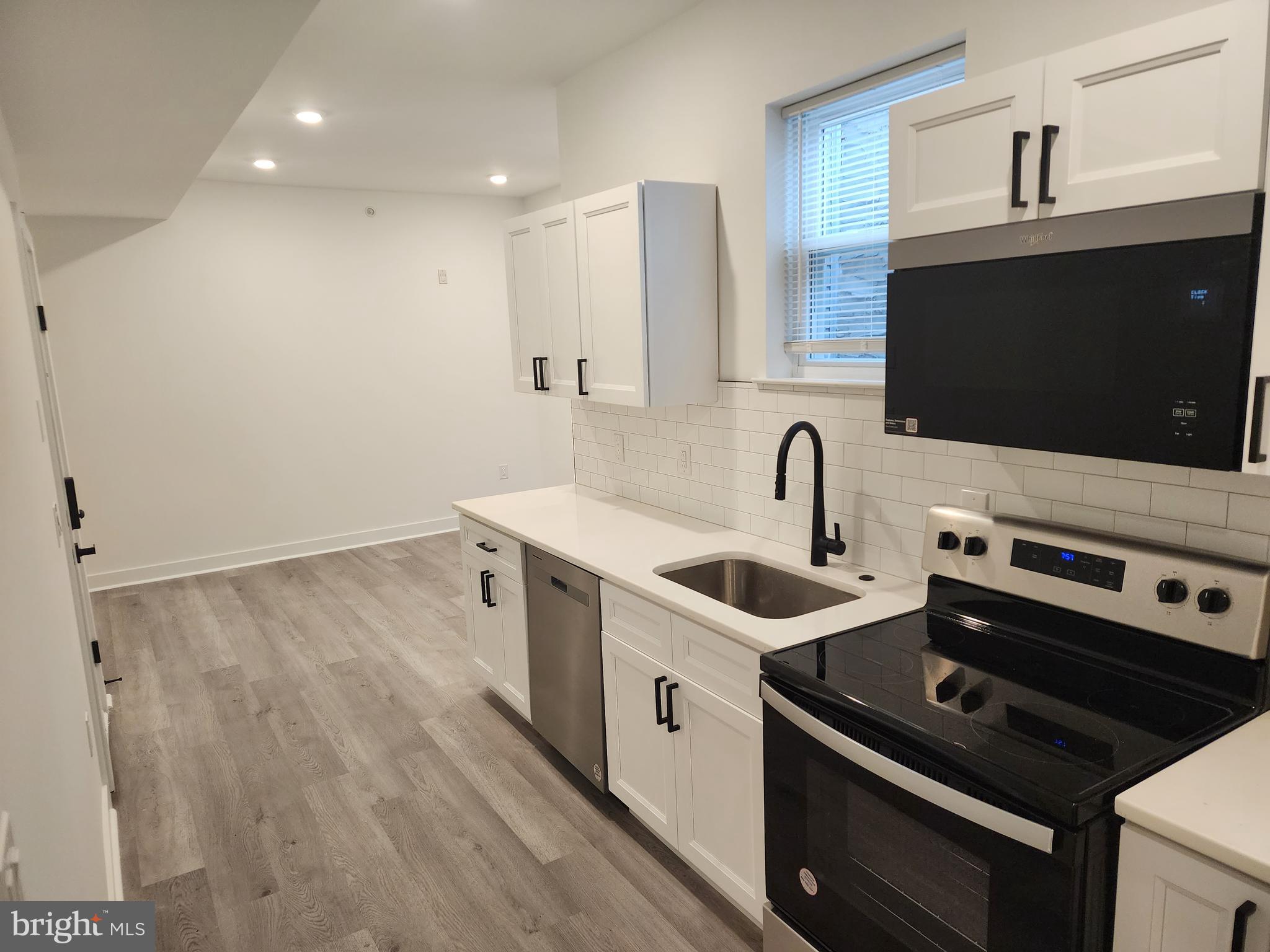 1838 North 17th Street, Unit 3 Philadelphia, PA 19121 - Photo 2 of 14 a kitchen that has a sink and a stove