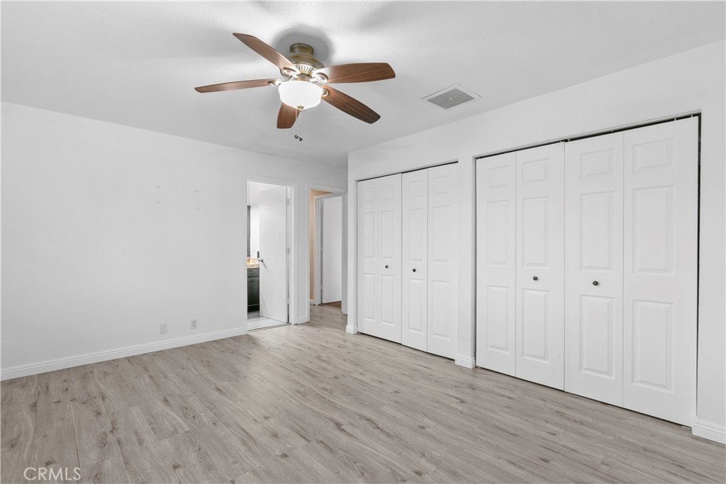 68295 Marina Road Cathedral City, CA 92234 - Photo 12 of 39 a view of an empty room with wooden floor