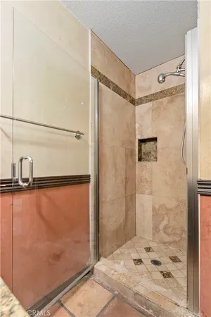 a bathroom with a shower and a sink