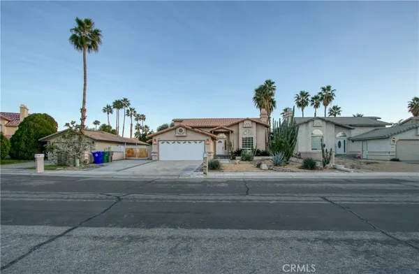 a house with a yard and a car park