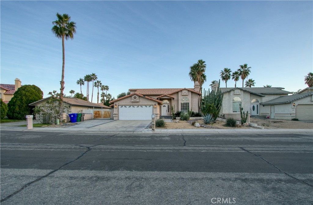 68295 Marina Road Cathedral City, CA 92234 - Photo 2 of 39 a house with a yard and a car park