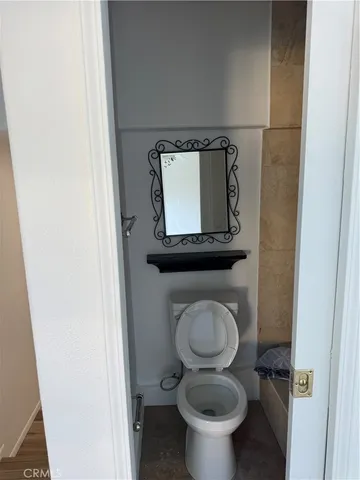 a bathroom with a toilet and a sink